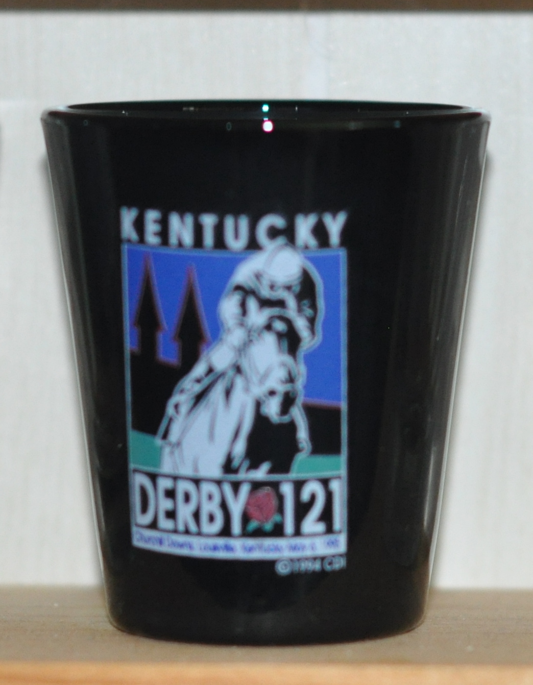 the FRONT of the glass